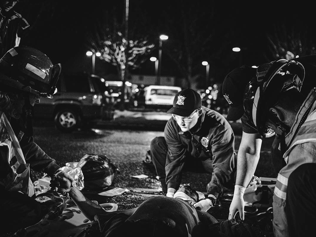 Medics helping person struck by vehicle