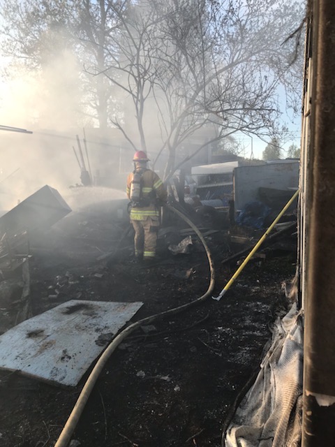 A firefighter from Valley Regional Fire Authority is working on a house fire.