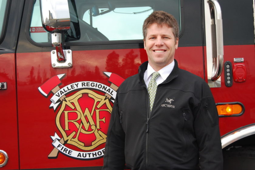 A man standing in front of a Valley Regional Fire Authority fire truck.
