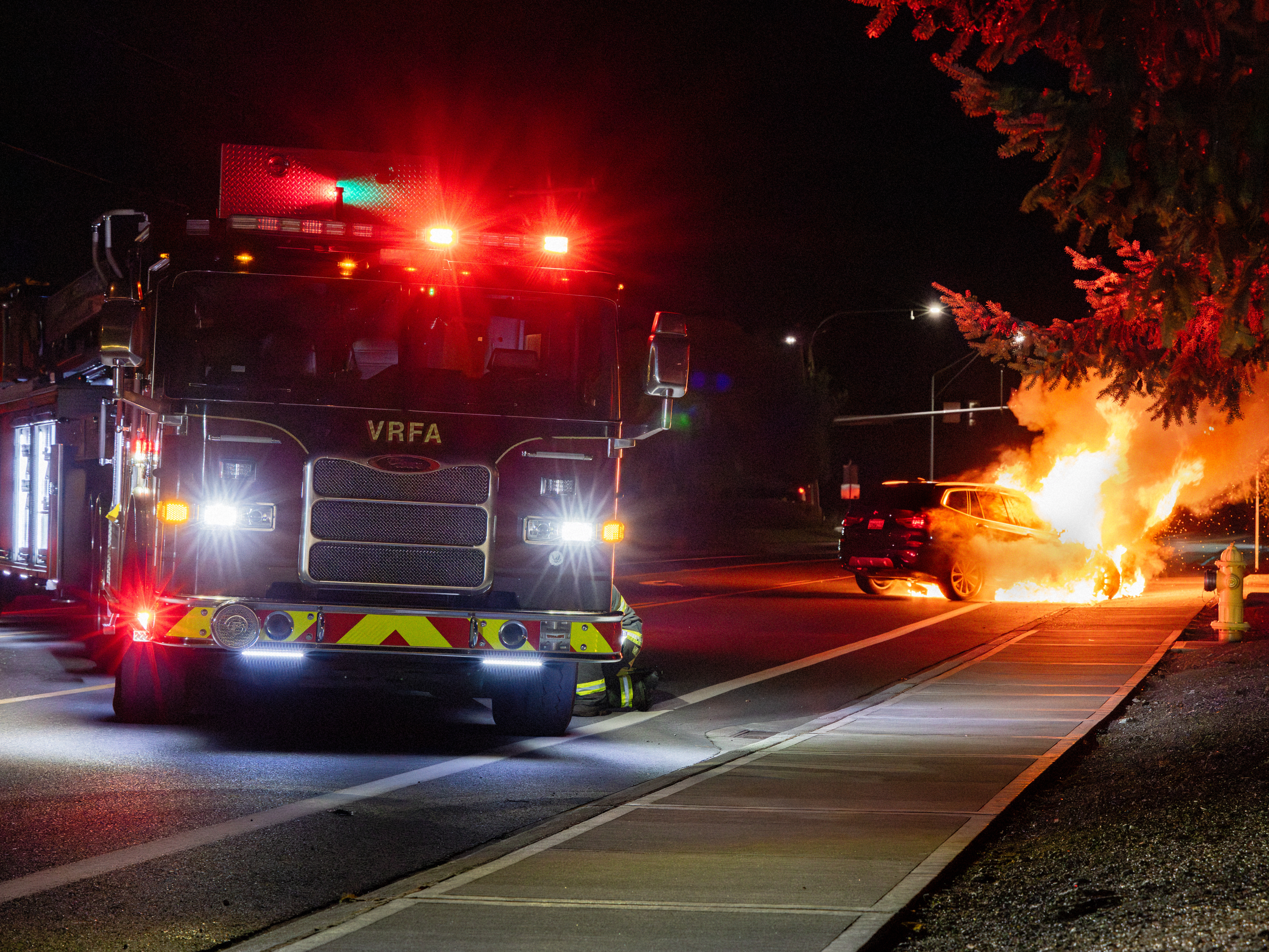 VRFA fire truck next to a vehicle on fire