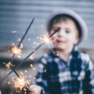 Child holding a sparkler