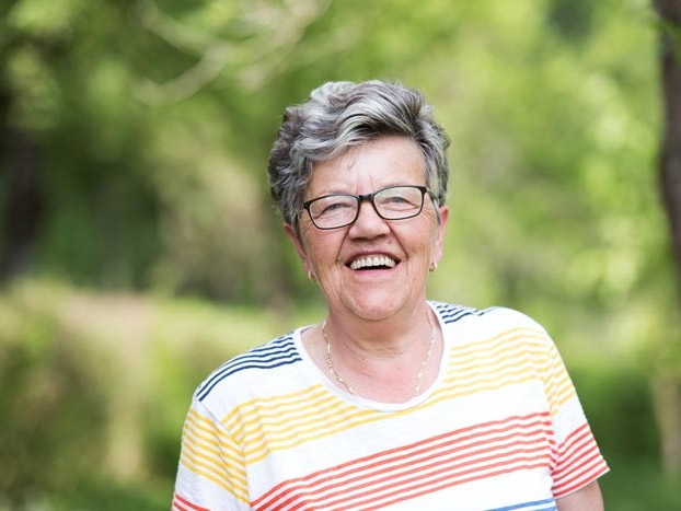 Elderly woman smiling at camera