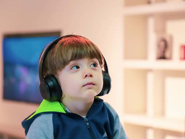 Headphones on deaf child