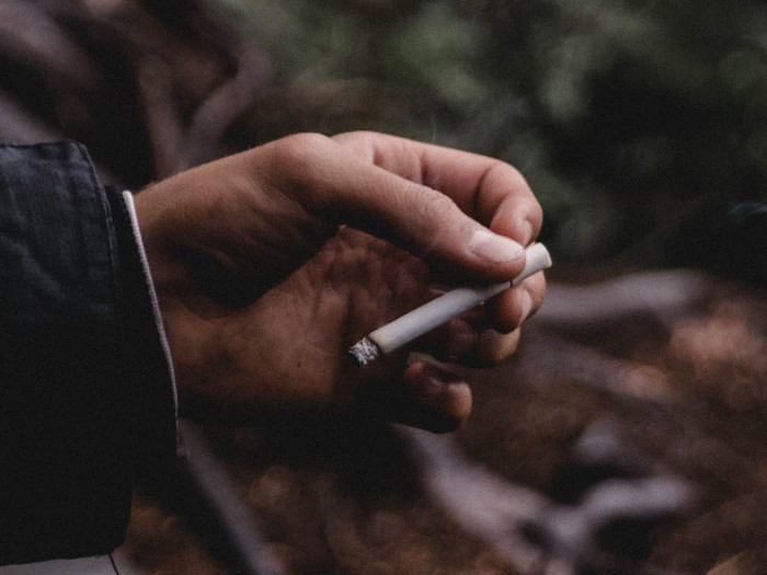Cigarette flung into wilderness