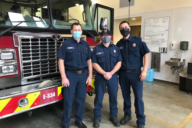 Three firefighters from the Valley Regional Fire Authority standing in front of a fire truck.