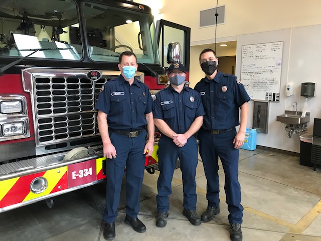 Three firefighters from the Valley Regional Fire Authority standing in front of a fire truck.