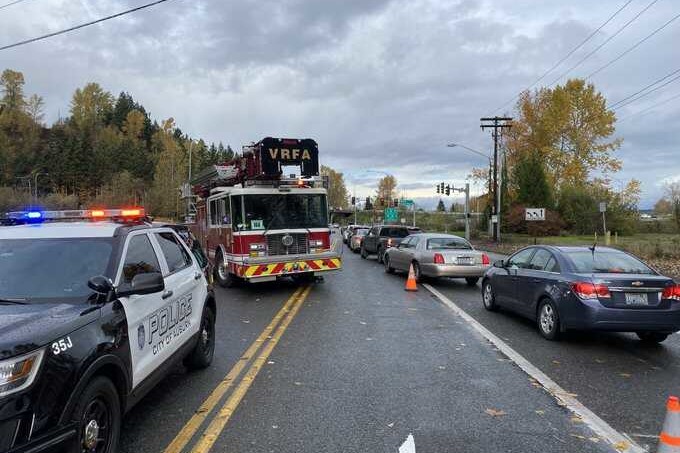 car crash response with fire truck strung across street