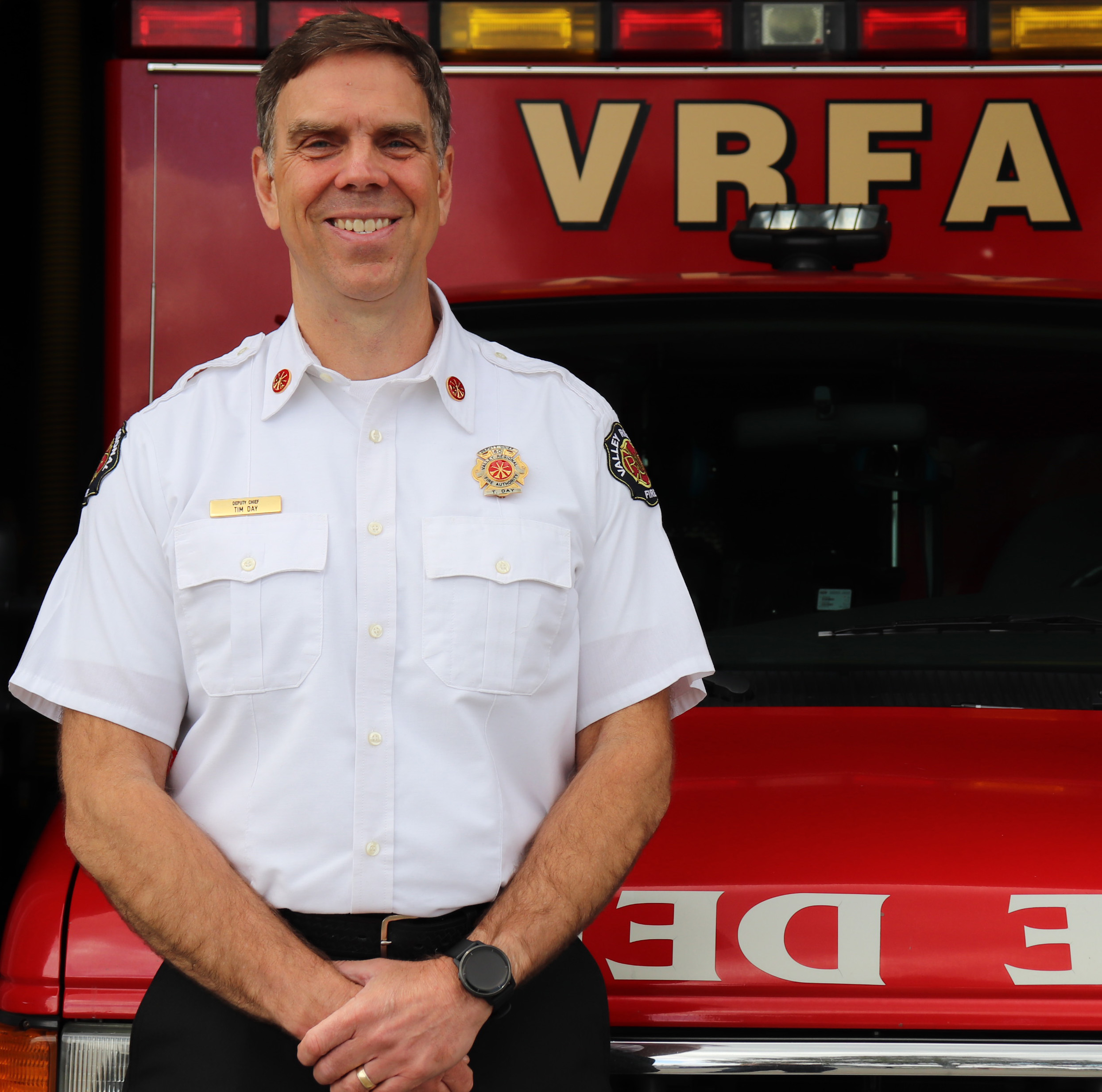 Tim Day in front of ambulance