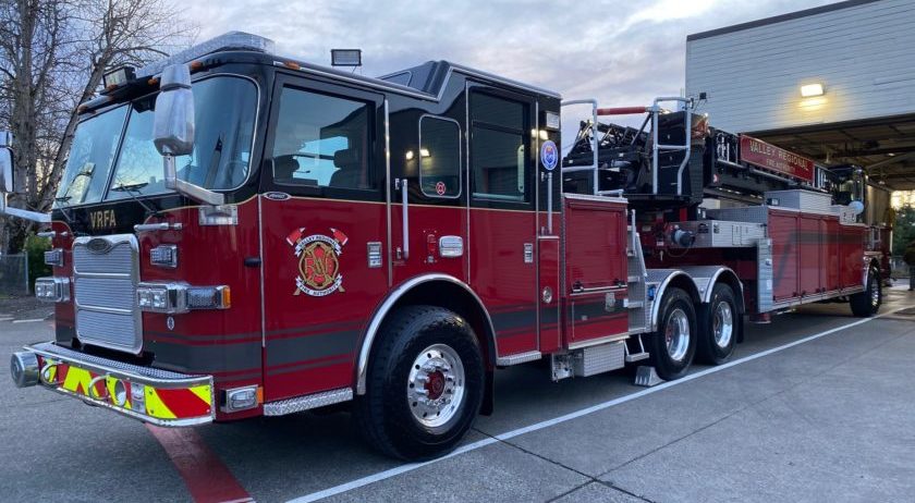 A red fire truck from Valley Regional Fire Authority parked in front of a building.