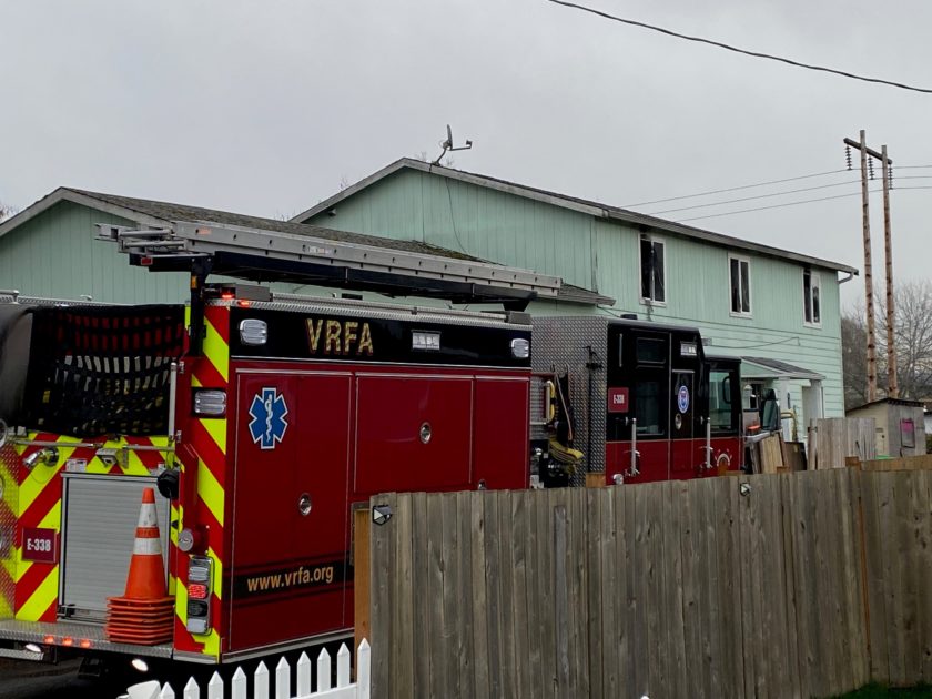 Two Valley Regional Fire Authority fire trucks parked in front of a house.