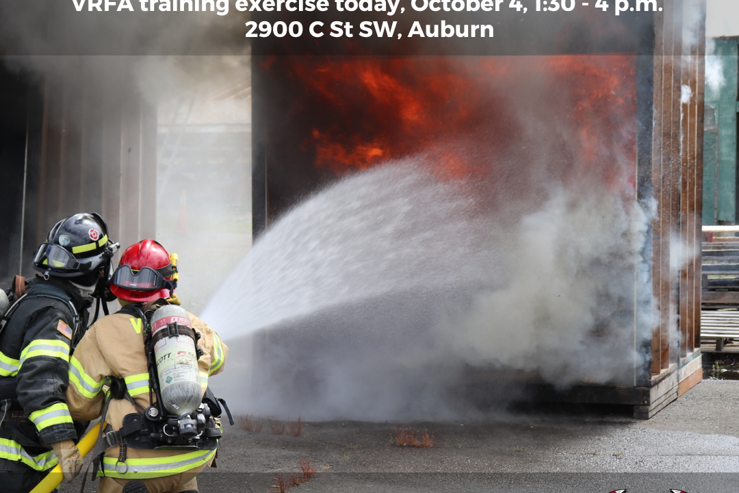 A Valley Regional Fire Authority firefighter providing rescue service by spraying a fire with a fire extinguisher.