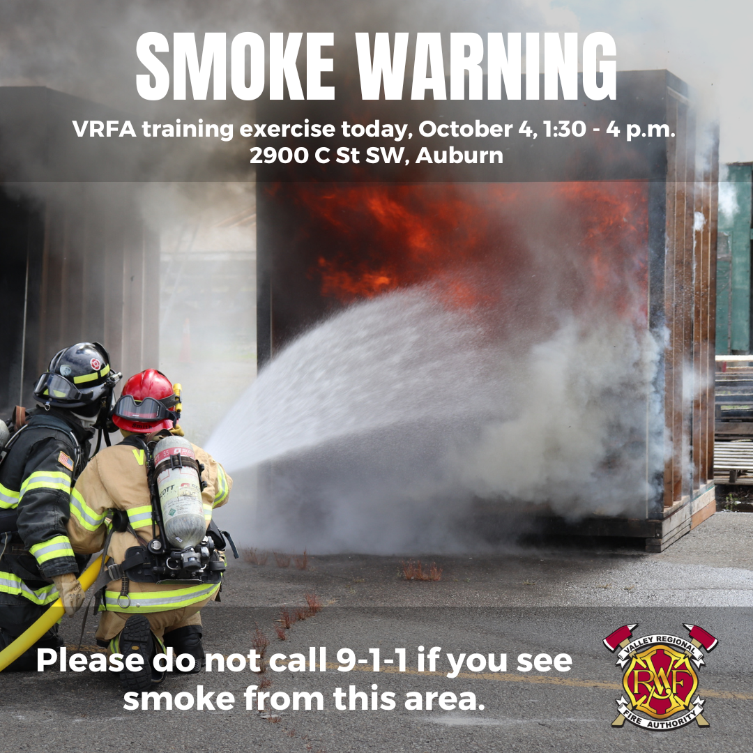 A Valley Regional Fire Authority firefighter providing rescue service by spraying a fire with a fire extinguisher.