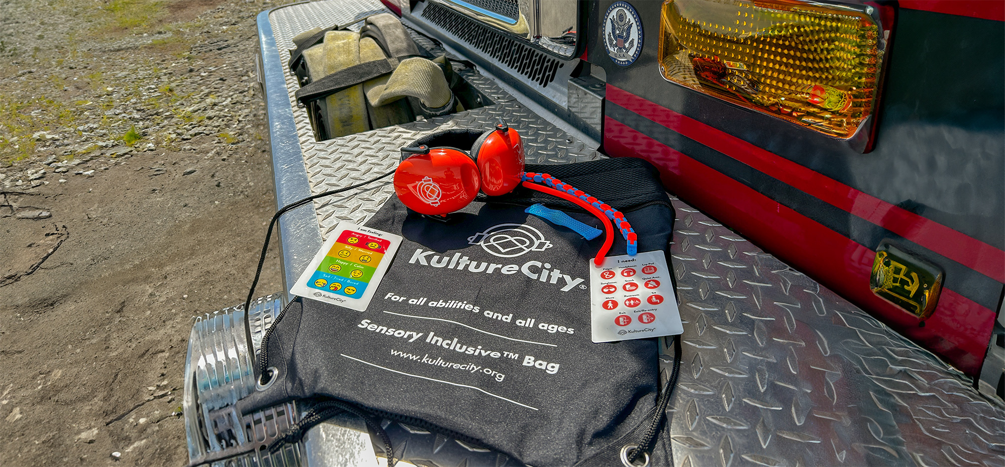 KultureCity™ Bag on a vehicle, containing red noise-canceling headphones