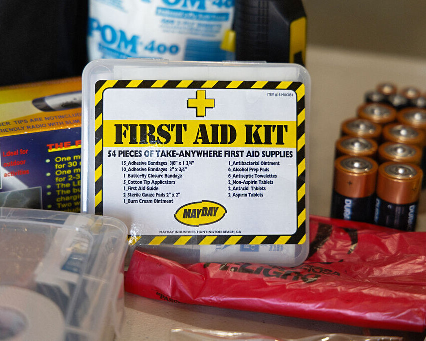 A first aid kit labeled 